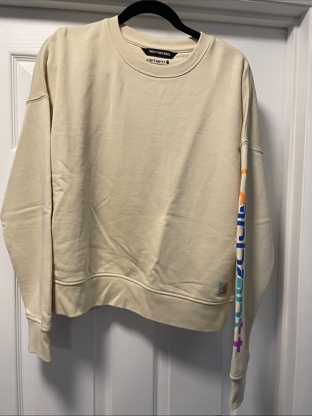 Carhartt Women's Cream Crewneck Sweatshirt with Rainbow Sleeve Logo